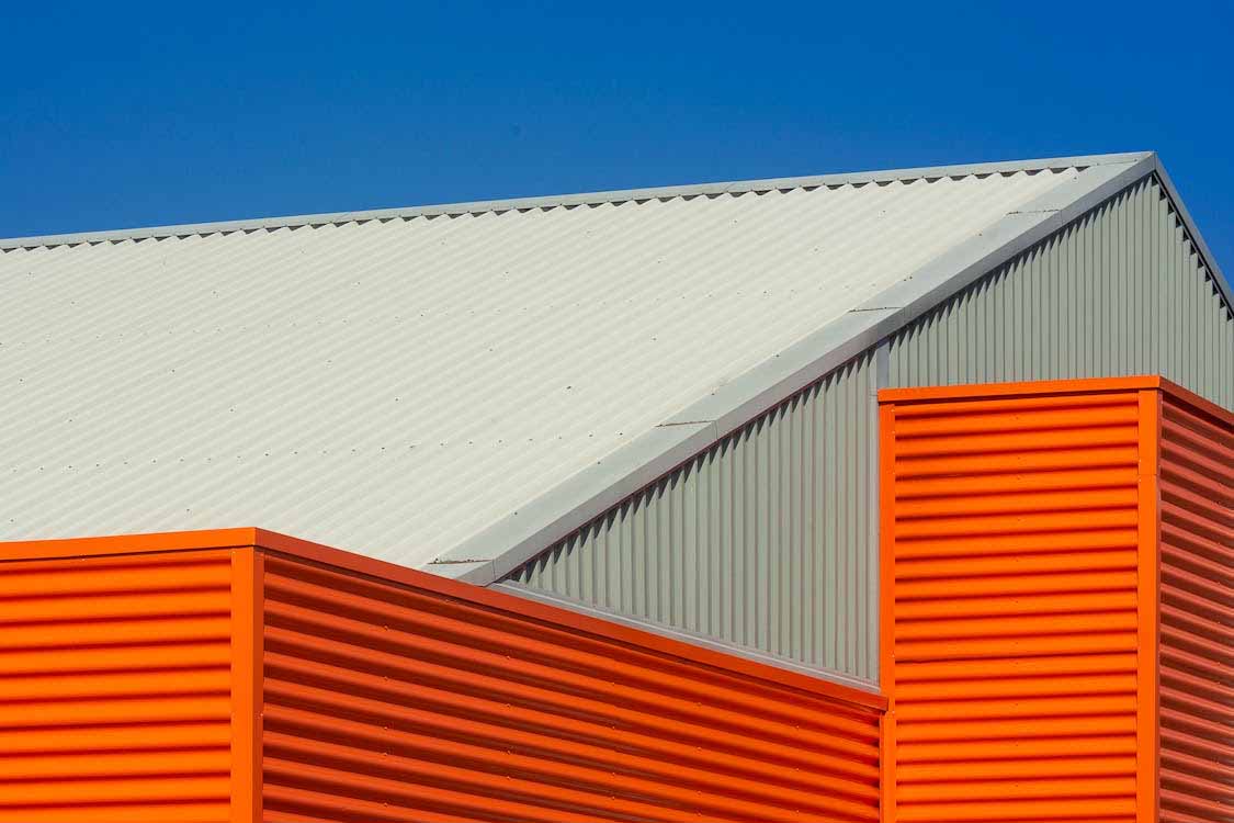 Commercial long-run steel roof and cladding on an Auckland industrial building